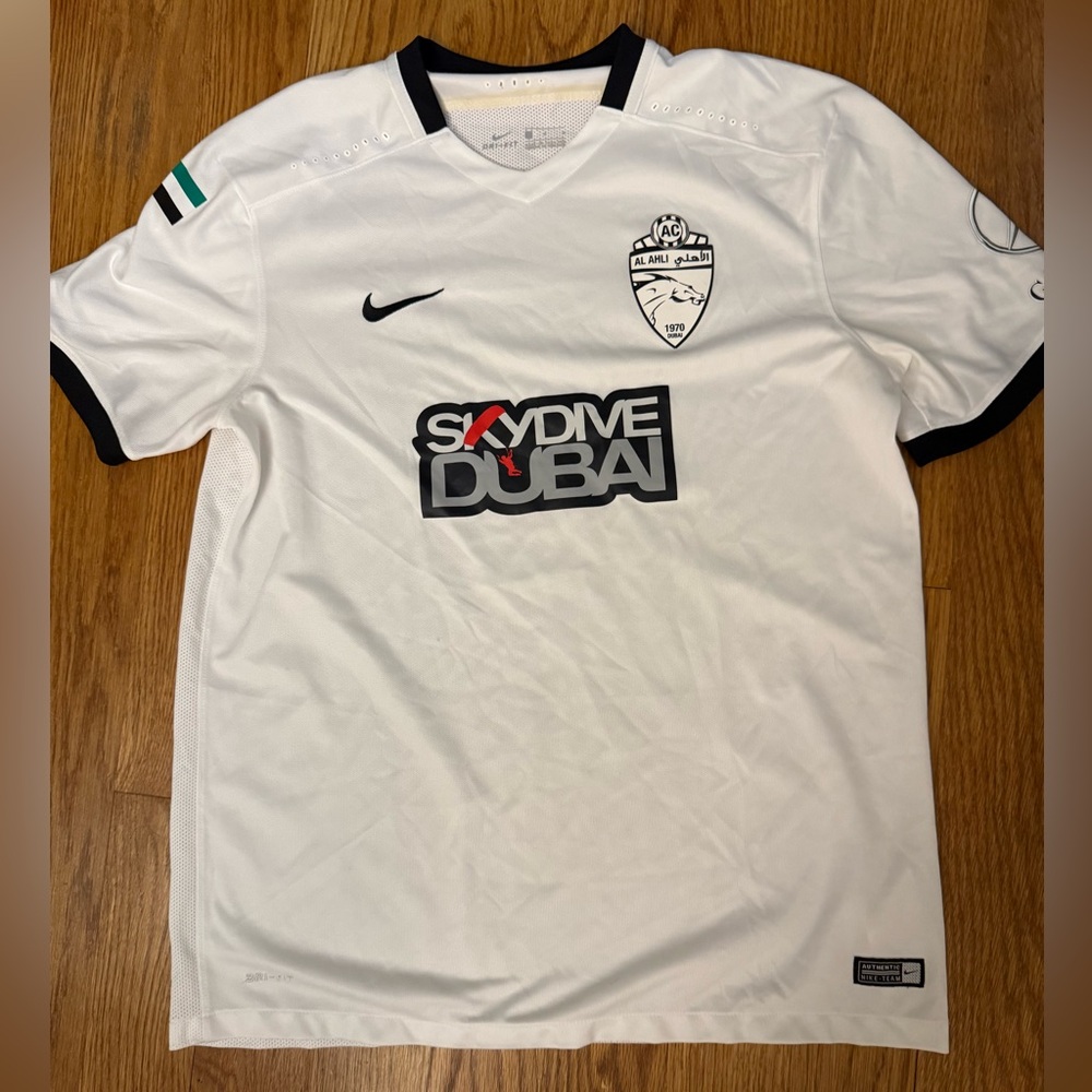 Nike White and Black soccer jersey.